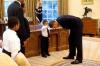 little boy feeling the presidents hair in the oval office