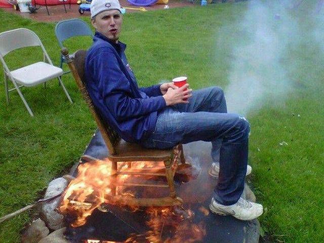 when you are sitting in the hot seat for real, man on wooden chair in fire