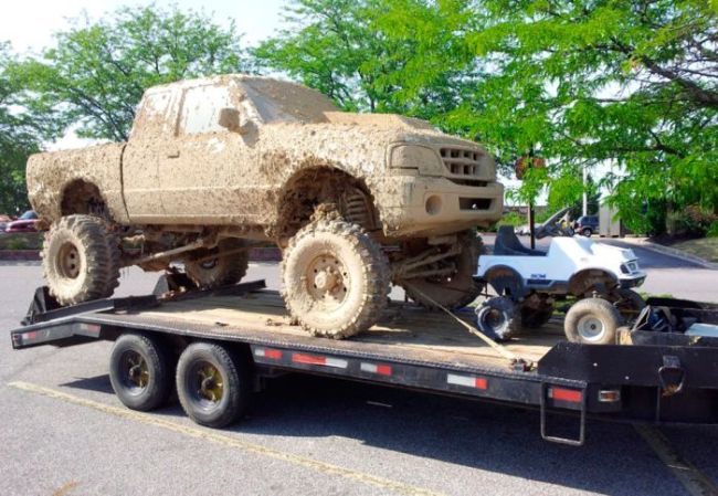 really dirty 4x4 truck with crazy shocks