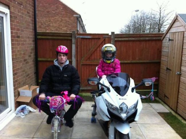 father and daughter riding their bikes