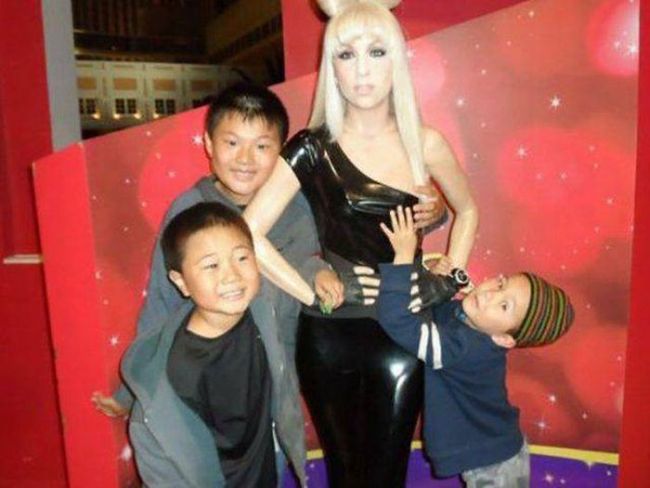 little asian kid is thirsty at the wax museum
