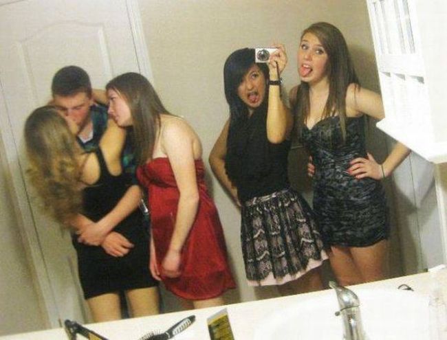 that girl might be a little bit jealous, couple kissing in bathroom with friend looking on