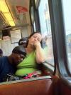 black guy sleeping on girlfriend's tit on the bus