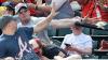 fan saves little boys face from flying baseball bat