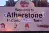welcome to ratherstoned, historic smokers town, town entrance sign hacked irl