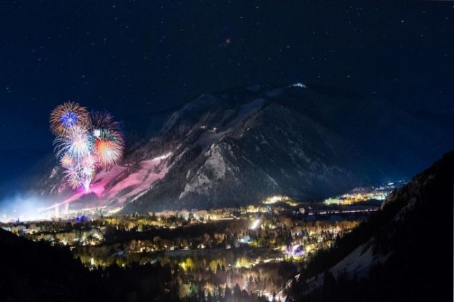 fireworks in front of a mountain