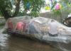 how to have a picnic in the rain, transparent plastic tarp over picnic bench at birthday party