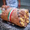 the bazooka is a giant cannoli shell that’s filled with 50 standard sized cannolis