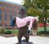 bear statue holding passed out woman, when statues attack