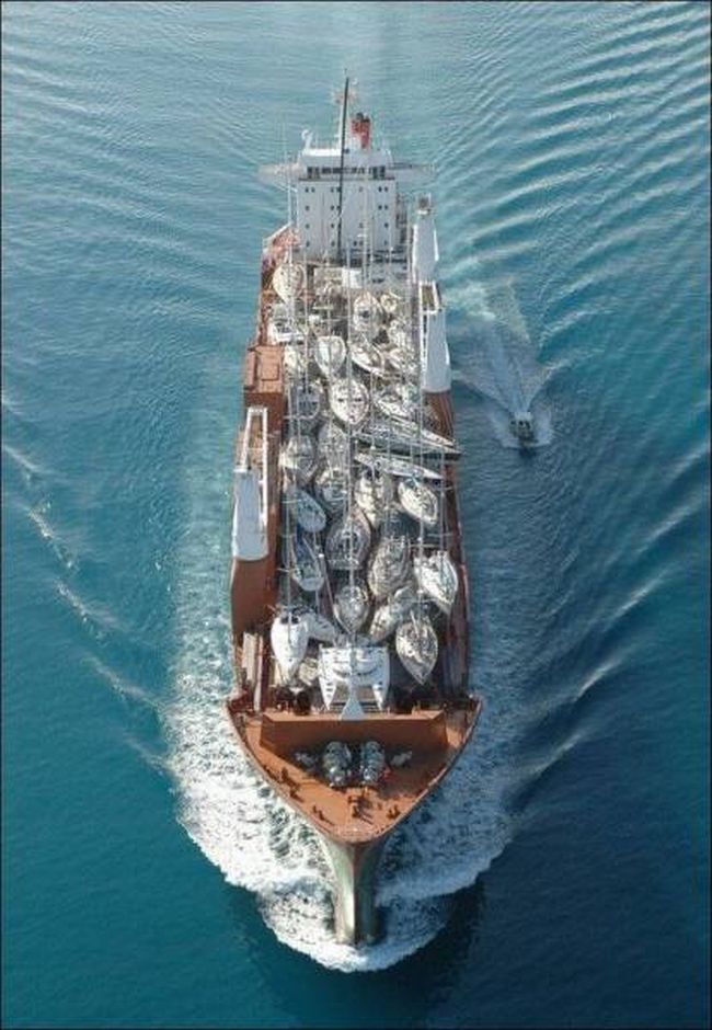 a ship shipping yachts