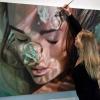 hyper realistic painting of girl blowing bubbles underwater