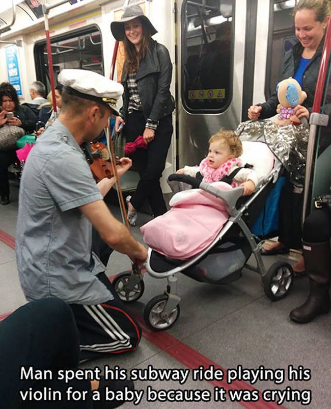 man spent his subway ride playing his violin for a baby because it was crying
