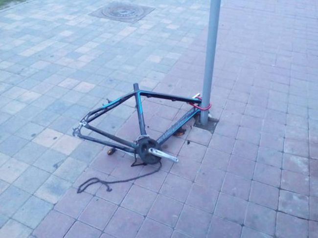bicycle picked clean locked to pole