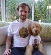 man and dog share t-shirts of each other