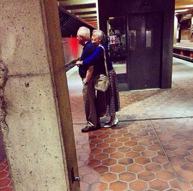 love knows no age, old couple hugging in subway