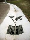 the world is going down the drain in this street art