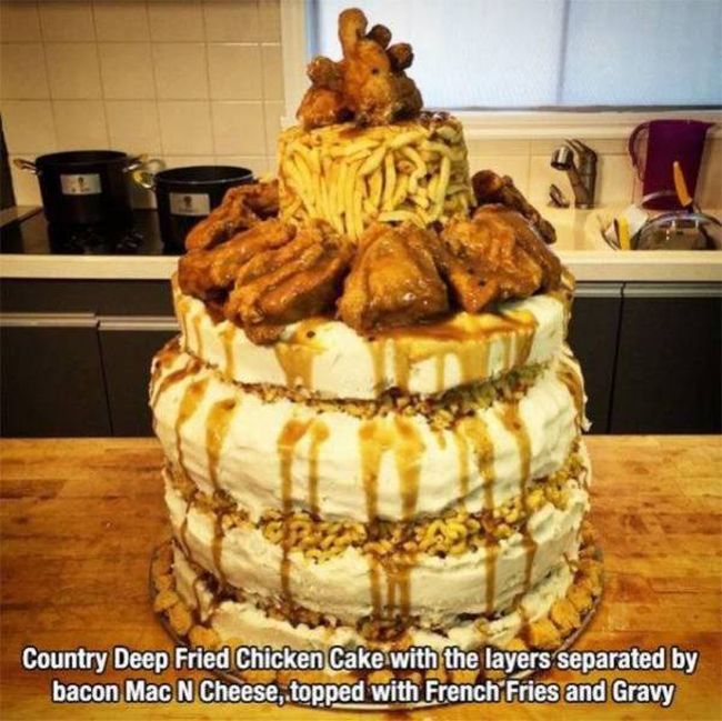 country deep fried chicken cake with the layers separated by bacon mac n cheese topped with french fries and gravy