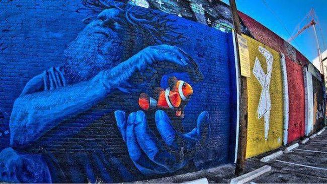 goldfish with poseidon on this wall, street art