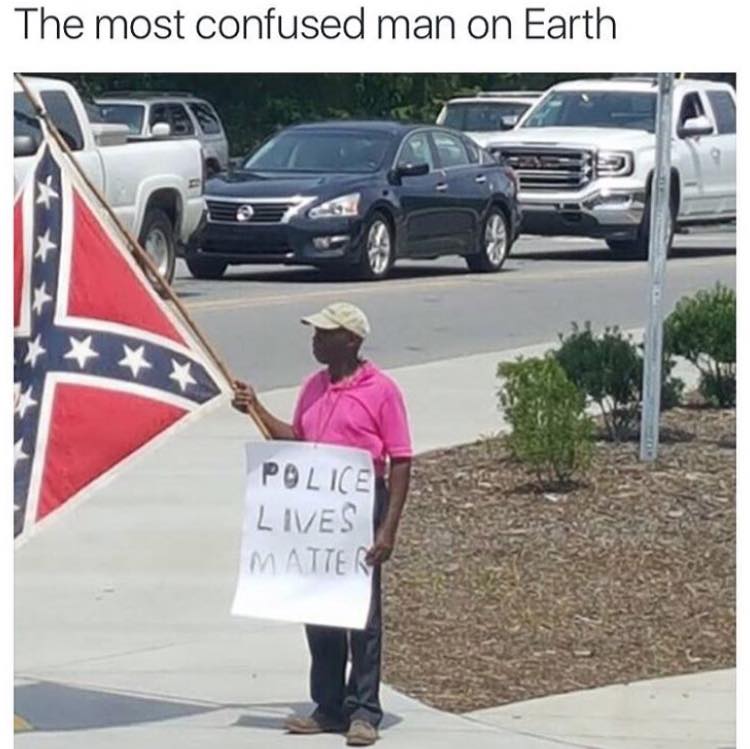 the most confused man ever, black guy holding confederate flag and sign saying police lives matter
