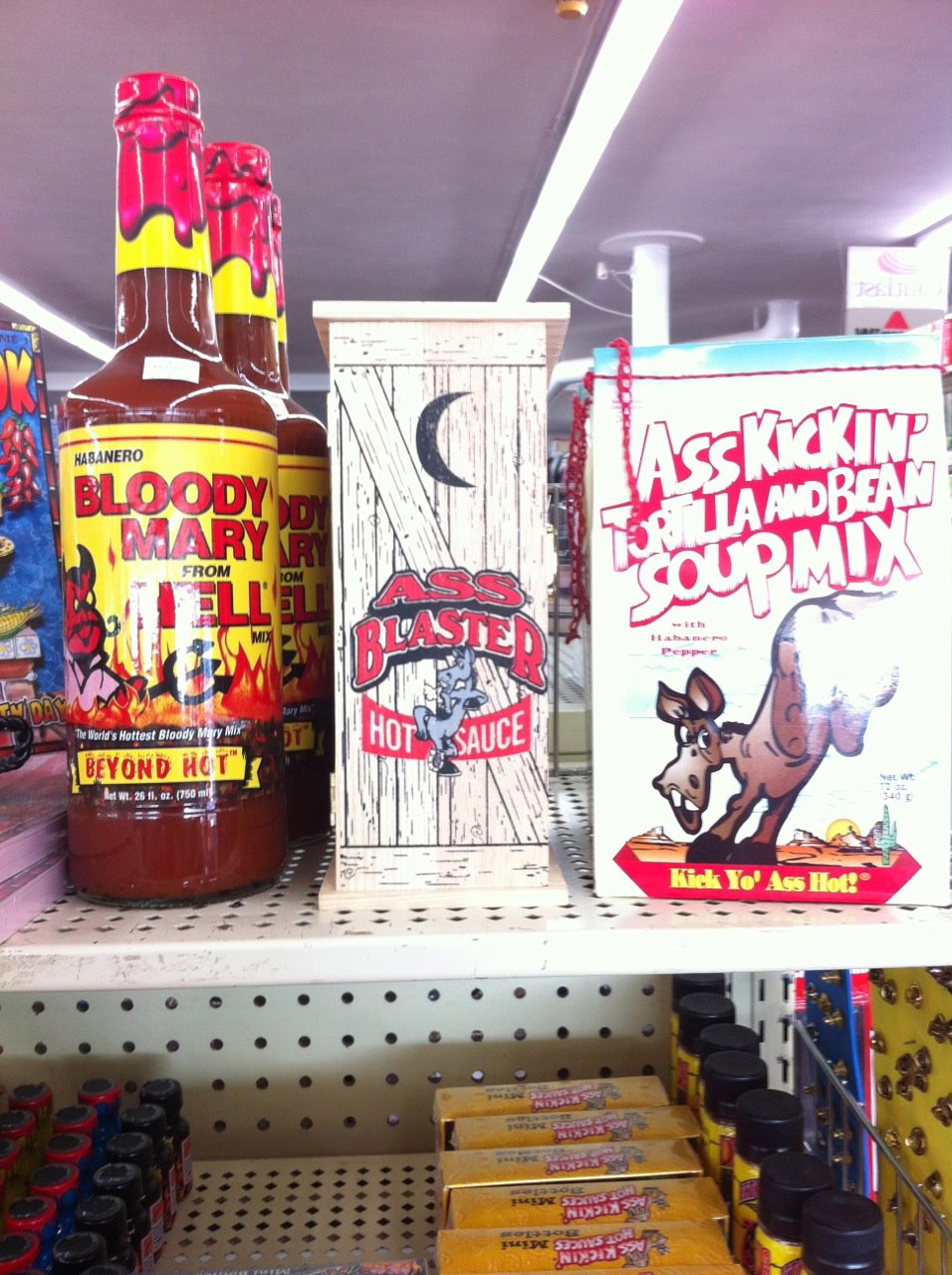 ass blaster hot sauce comes in a box shaped like an outhouse, wtf
