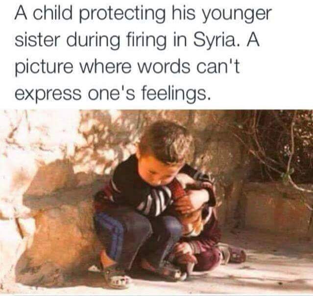 a child protecting his younger sister during firing in syria, a picture where words can't express one's feelings