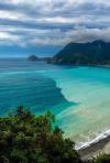 beautiful view of the ocean and some mountains