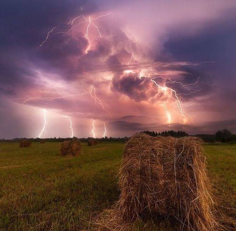 lightning in storm clouds over farmland