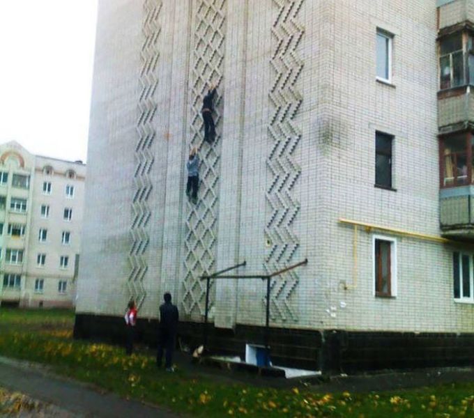 climbing the wall of an apartment block