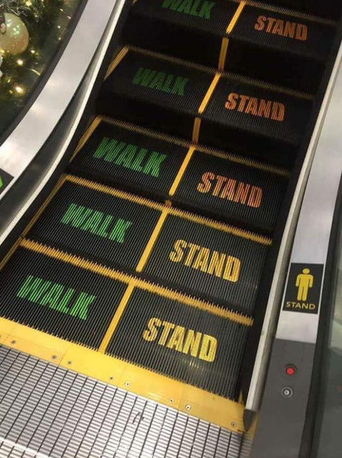 walk and stand labels on escalator