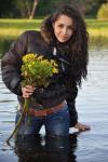 girl poses with flowers in water, wtf