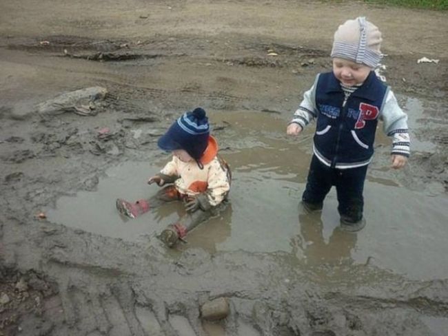 kids loving playing in the mud