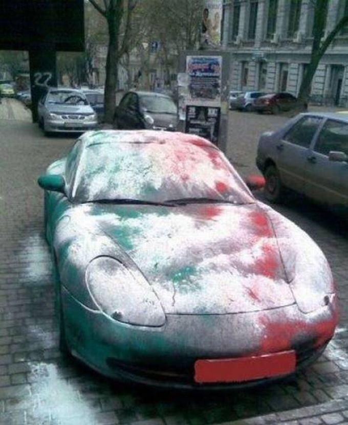 car attacked with green red and white spray paint