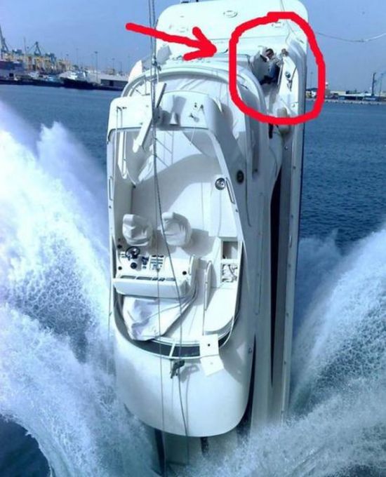 how the heck does this happen, yacht falling into water nose first and guy standing on back