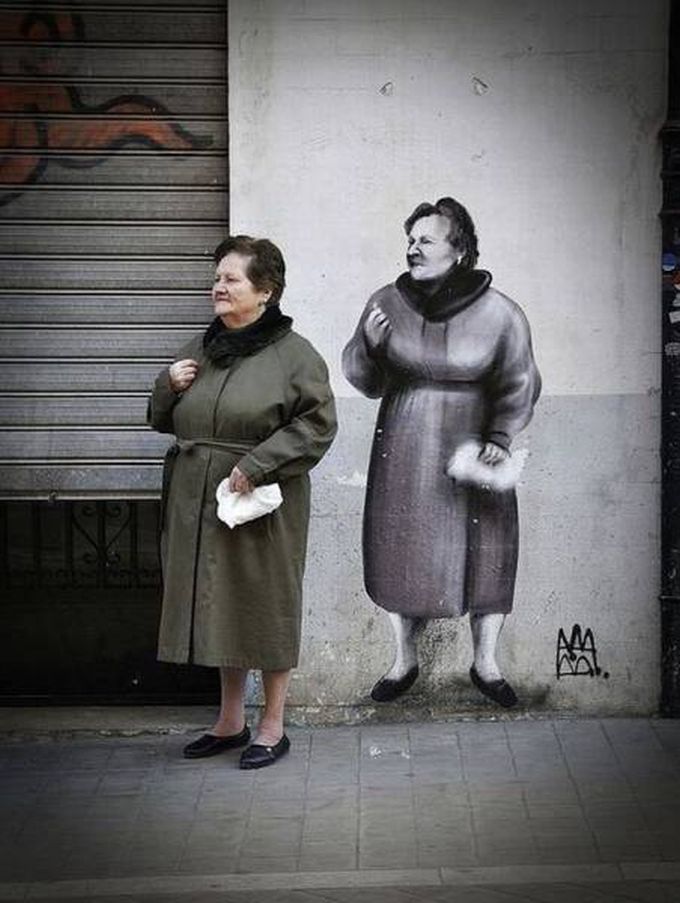 street art of old woman on wall