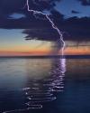 reflection of lightning over water