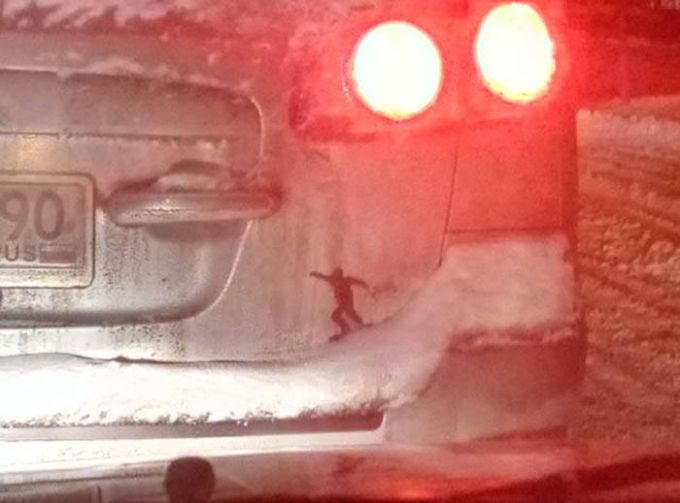 snowboarding silhouette on a dirty car