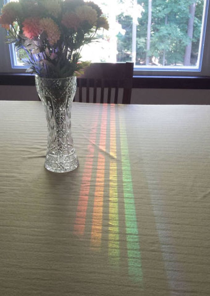 rainbow on table through window