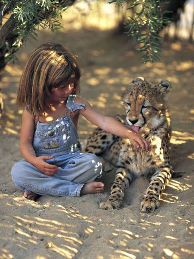 little girl and leopard cub, cute