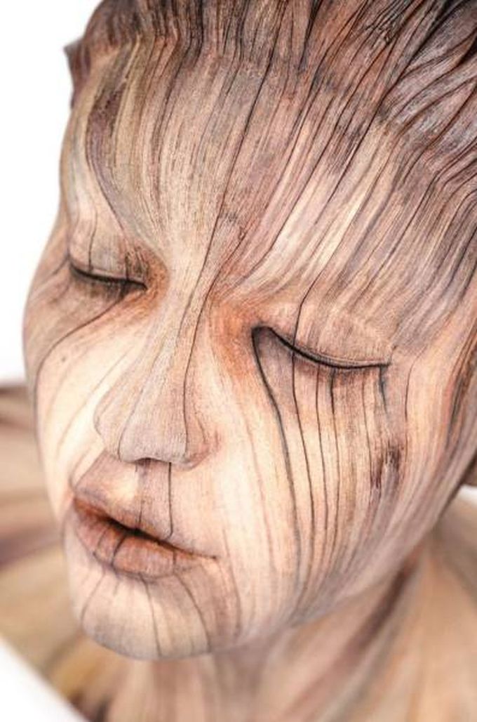 beautiful sculpture of face in wood