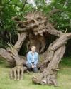 big wooden tree sculpture and the artist that created him