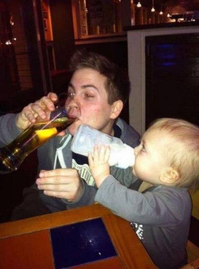 father and son drinking together