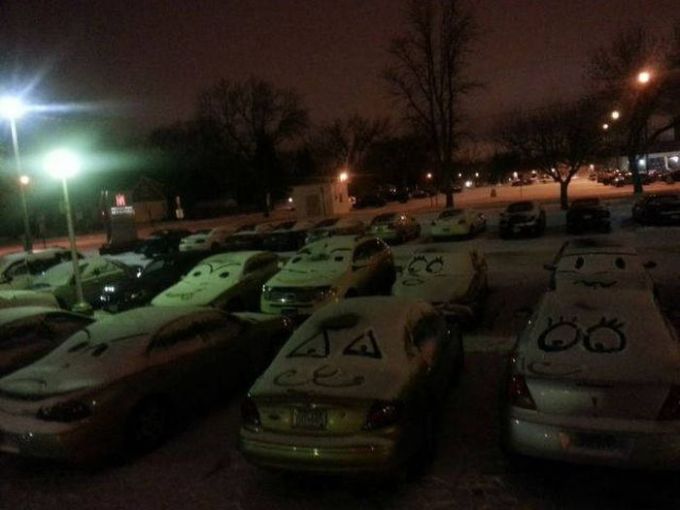 faces on snowy cars
