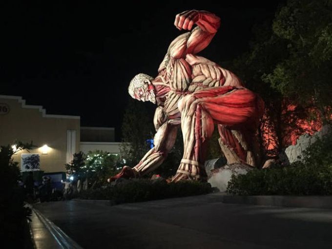 huge muscle sculpture at night