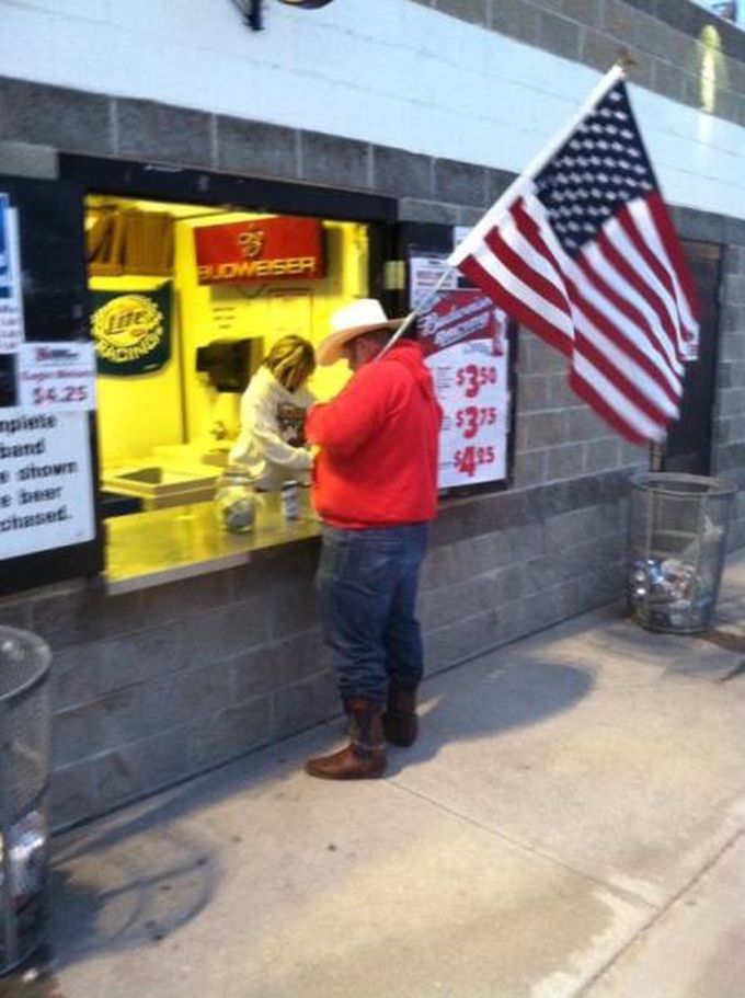 a true patriot, cowboy hat wearing fat man holding us flag