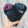 dark flavour ice cream in black sugar cone