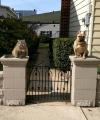 what's the password?, dog and cat on either side of fence pillars