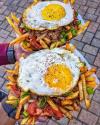 a very manly breakfast, eggs on steak fries salad