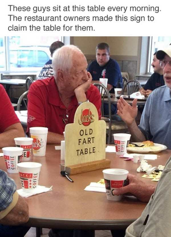 these guys sit at this table every morning, the restaurant owners made this sign to claim the table for them, old fart table