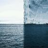 a photo with four perfect quadrants, ice berg, ocean