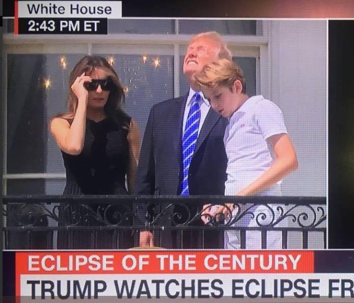 trump watches eclipse from balcony